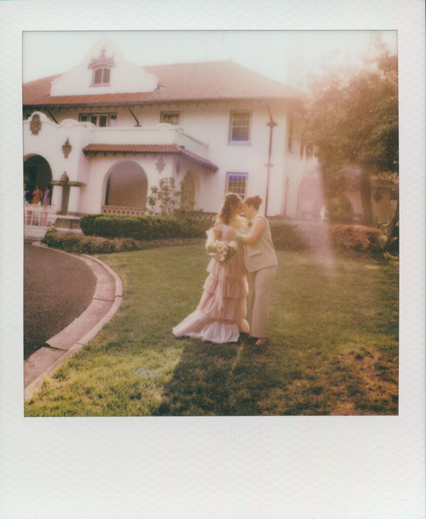 Instant film portrait of a romantic embrace outside Hill House.