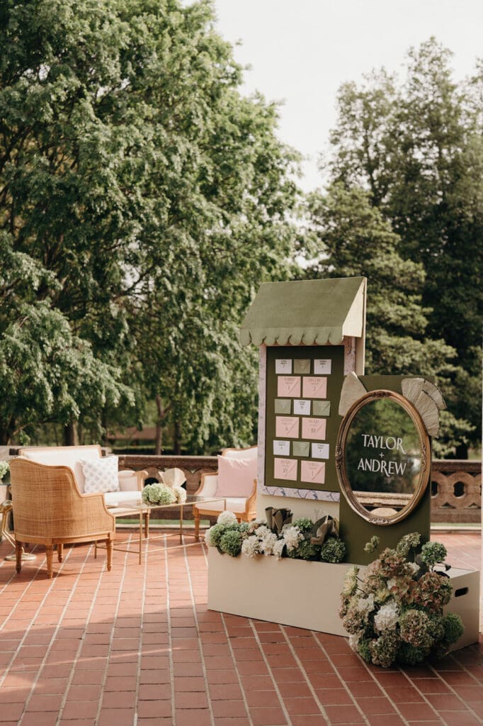 Outdoor seating chart display for a romantic garden wedding.