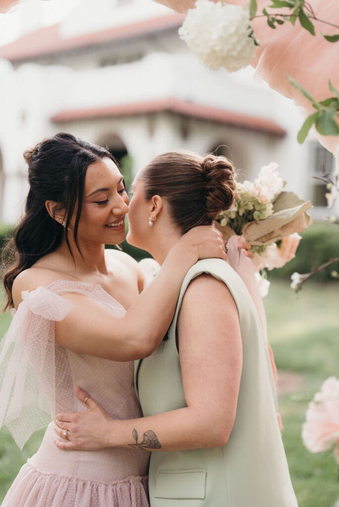 Couple embracing during editorial wedding portraits at Hill House.
